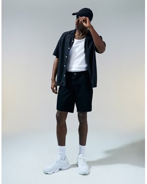 ASOS DESIGN slim regular längd denimshorts i svart