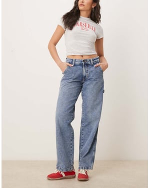 Dickies stevensville baggy carpenter denim jeans in rinsed blue with fade