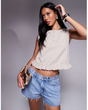 ASOS DESIGN sleeveless waffle button through top in mini frill hem in cream