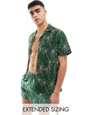 ASOS DESIGN koord avslappnad revere strandskjorta i doodle palmträdsmönster i grön