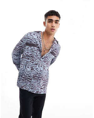 ASOS DESIGN avslappnad skjorta med krage i leopardmönster och kontrasterande krage