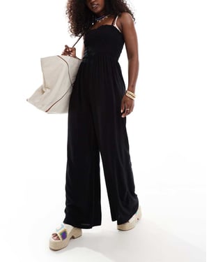 ASOS DESIGN rynkad bandeau strandoverall i svart