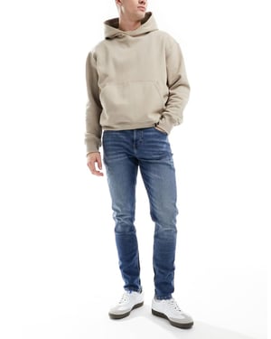 ASOS DESIGN skinny jeans i vintage mellanblå tvätt