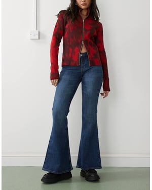 Monki Katsumi låg midja bootcut flare jeans i mörk oceanblå tvätt