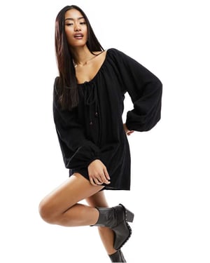 ASOS DESIGN långärmad jumpsuit med pärldetaljer i svart