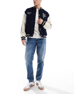 ASOS DESIGN tapered jeans i tonad mörkbla tvätt