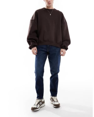 ASOS DESIGN stretch tapered jeans i mörk tvätt