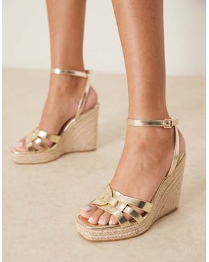Glamorösa espadrillos klacksandaler i guld