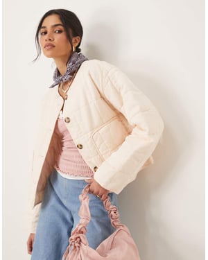 ASOS DESIGN crop collarless quilted jacket in cream