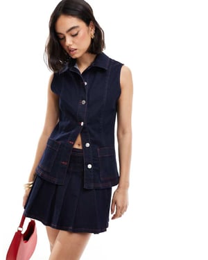 ASOS DESIGN denim väst med passform i indigoblå