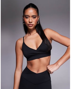 4505 wrap front seamless light support sports bra in black