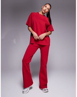 ASOS DESIGN samordnad interlock flare jogger i röd