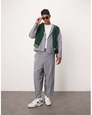 ASOS DESIGN avslappnade byxor med rörlig ben i grått