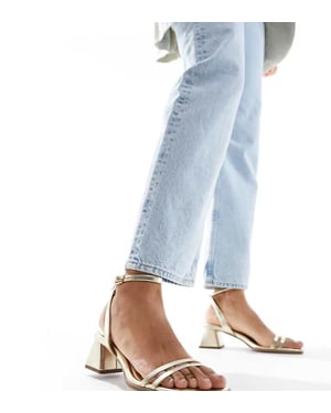 ASOS DESIGN Wide Fit Honeydew mid block heeled sandals in gold