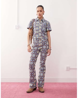 Wrangler co-ord bootcut 70s print jeans in blue