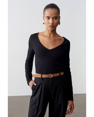 Slim Fit V-ringad stickad blus
