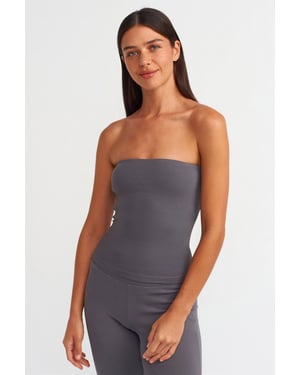 Stövlad kroppsnära bandeau-blus