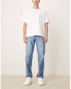 ASOS DESIGN straight leg jeans light wash blue