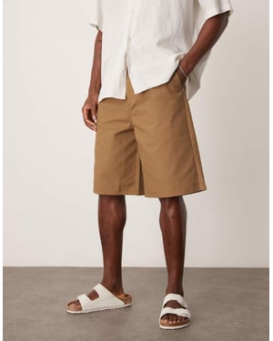 ASOS DESIGN long length pleated shorts in tan