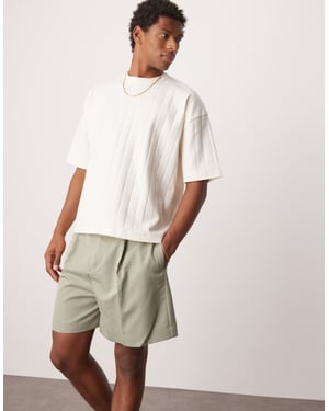 ASOS DESIGN smart bermuda shorts with front pleat and belt detail in green
