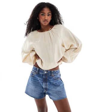 ASOS DESIGN denim relaxed short in midwash blue
