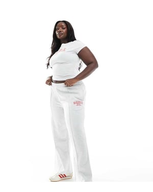ASOS DESIGN Curve straight leg jogger with Marseille embroidered graphic in ice marl