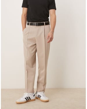 ASOS DESIGN smart relaxed tapered fit trousers with front pleat in stone