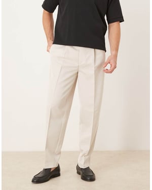 ASOS DESIGN smart oversized tapered trousers with front pleat in ecru