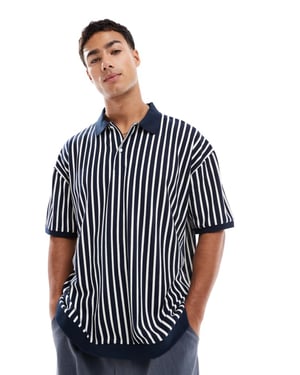 ASOS DESIGN oversized polo in black and white stripe