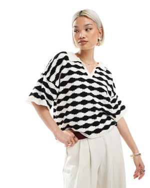 ASOS DESIGN knitted stitch relaxed polo top in mono stripe