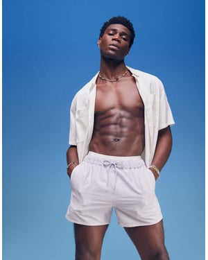 ASOS DESIGN seersucker swim shorts in short length in purple