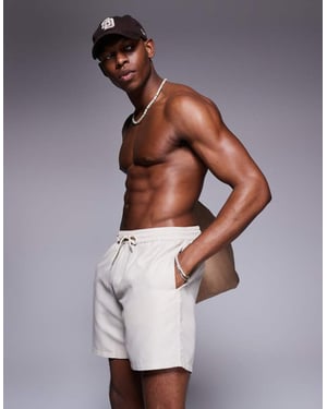 ASOS DESIGN swim shorts in mid length in light stone