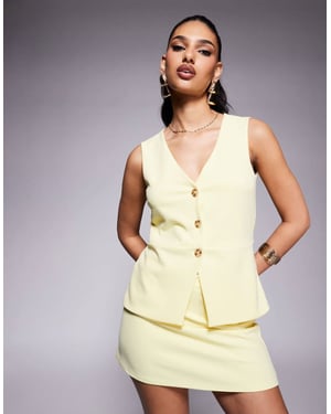 ASOS DESIGN koord långärmad knapplång väst i smörgul