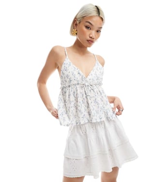 Miss Selfridge bow detail peplum cami top in ditsy floral