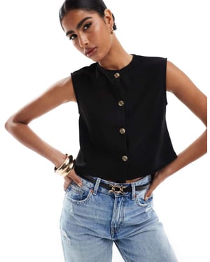 ASOS DESIGN ribbed wide shoulder boxy cropped waistcoat in black
