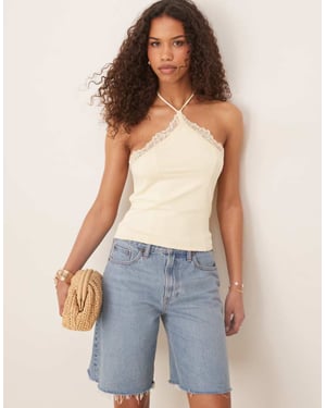 ASOS DESIGN slinky lace trim halter top in pale yellow