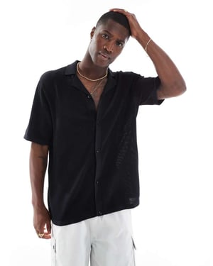 Jack & Jones överdimensionerad knappad stickad polo i svart