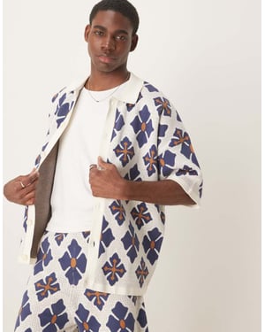 ASOS DESIGN avslappnad stickad knäppd polo-set med aztekmönster i blått