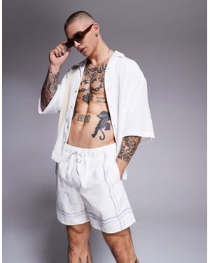 ASOS DESIGN badbyxor i medellängd i beige med kanttryck