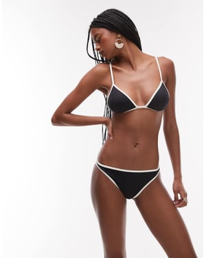 ARKET mix & match bikiniunderdel i svart med kantband i krämfärgad kontrast