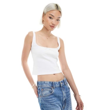 Miss Selfridge väst med picotkant och rosett i vitt