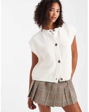 ASOS DESIGN boxy knitted stitch waistcoat with button detail in cream