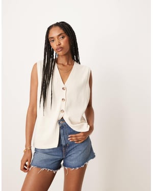 ASOS DESIGN ren stickad avslappnad passform väst i krämfärg