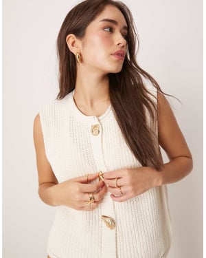 ASOS DESIGN knitted boxy waistcoat with multi shell buttons in white