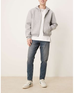 ASOS DESIGN stretch tapered i medelblå tvätt