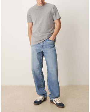 ASOS DESIGN baggy jeans i mellansom tvättad blå
