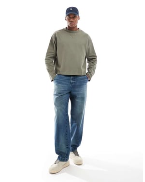 ASOS DESIGN baggy snickarjeans i mörk tvättad blå