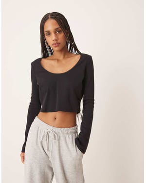 ASOS DESIGN ribbed long sleeve boxy crop top with trim detail in black