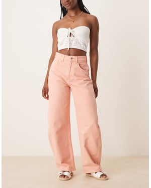 ASOS DESIGN högmidjade fasthylsbyxor i mjuk aprikos