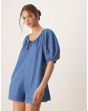 ASOS DESIGN soft denim playsuit with balloon sleeves in midwash blue